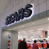 In this Nov. 15, 2011 photo, customers enter a Sears store, in Springfield, Ill. Sears Holdings Corp.’s third-quarter loss widened, dragged down by weakness in Canada, declining consumer electronics sales and softer clothing sales at its Kmart stores.  (AP Photo/Seth Perlman)