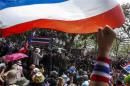 Anti-government protesters gather outside the Royal Thai Police headquarters during a rally in central Bangkok