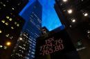 A sign displaying TSX information is seen in Toronto