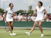 Heather Watson of Britain and her partner Laura Robson of Britain laugh during their women's doubles tennis match against Hsieh Su-Wei of Taiwan and Sabine Lisicki of Germany at the Wimbledon tennis championships in London
