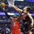 Miami Heat forward LeBron James (6) drives to the basket against Chicago Bulls center Joakim Noah during the first half of an NBA basketball game in Chicago, Thursday, Feb. 21, 2013. (AP Photo/Nam Y. Huh)