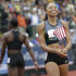 Allyson Felix, right, celebrates her win in the women's 200 meters at the U.S. Olympic Track and Field Trials Saturday, June 30, 2012, in Eugene, Ore. Felix won the 200 but she and Jeneba Tarmoh, walking off at left rear, tied for third place in the 100 meters. (AP Photo/Marcio Jose Sanchez)