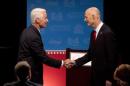 Democratic challenger, former Republican Gov. Charlie Crist (L) and Florida Republican Gov. Rick Scott, shake hands after participating in their second debate in Davie
