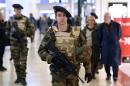 French soldiers patrol in a shopping center in Lyon on January 16, 2015