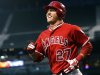 FILE - In this Aug. 31, 2012, file photo, Los Angeles Angels' Mike Trout smiles after scoring against the Seattle Mariners during a baseball game in Seattle. Trout unanimously won the American League Rookie of the Year Monday, Nov. 12. (AP Photo/Elaine Thompson, File)
