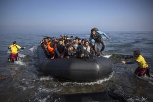 Migrants and refugees arrive on a dinghy from the Turkish&nbsp;&hellip;