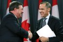Canadian Finance Minister Jim Flaherty, left, shakes hands with Bank of Canada Governor Mark Carney, right, in Ottawa, Ontario, Monday Nov. 26, 2012. Carney will become head of the Bank of England next summer. Flaherty called it a bittersweet moment as he announced Carney's new job as the first time a foreigner has been tabbed to run Britain's venerable national bank. (AP Photo/The Canadian Press, Fred Chartrand)