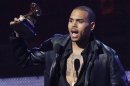 Chris Brown accepts the award for best R&B album for "F.A.M.E." at the 54th annual Grammy Awards in Los Angeles California