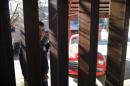 A man in Nogales, Sonora, Mexico looks through the U.S. border fence into Nogales
