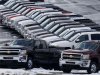 In this Wednesday, Jan. 9, 2013 photo, Chevy trucks line the lot of a dealer in Murrysville, Pa. Ford, Chrysler and General Motors all reported double-digit gains for January as last year’s momentum in U.S. auto sales continued into 2013, according to reports Friday, Feb. 1, 2013. (AP Photo/Gene J. Puskar)