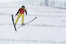 Bill Demong of the United States makes his jump during a men's Nordic combined, large hill, training session at the 2014 Winter Olympics, Monday, Feb. 17, 2014, in Krasnaya Polyana, Russia. (AP Photo/Dmitry Lovetsky)