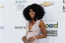 Recording artist Brandy Norwood poses on the red carpet as she arrives at the 2012 Billboard Music Awards in Las Vegas