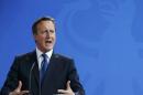 Britian's Prime Minister Cameron address news conference in Berlin