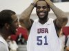 USA men's national basketball team member LeBron James (51) laughs with teammate Chris Paul during practice at the Mendenhall Center on the UNLV campus in Las Vegas on Friday, July 6, 2012.  (AP Photo/Las Vegas Review-Journal, Jason Bean)
