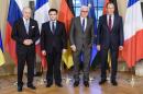French Foreign Minister Laurent Fabius, Ukrainian Foreign Minister Pavlo Klimkin, German Foreign Minister Frank-Walter Steinmeier and Russian Foreign Minister Sergey Lavrov, from left, pose for a group photo at Villa Borsig, the official guest house of the foreign ministry, in Berlin on Monday, April 13, 2015 before their meeting to discuss implementation of the peace agreement brokered in Minsk, Belarus in February. (Clemens Bilan/Pool Photo via AP)