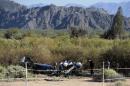 Investigators examine on March 12, 2015 the wreckage of one of the two helicopters that crashed on March 10 in Villa Castelli, in the Argentine province of La Rioja, northern Argentina