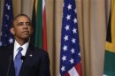 U.S. President Obama listens to South Africa's President Zuma's remarks at joint news conference in Pretoria