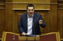 Greece's Prime Minister Alexis Tsipras addresses the parliament during his government's policy statement in Athens, on Sunday, Feb. 8, 2015. Tsipras came to power two weeks ago riding a wave of hope for change. But his pledge to rewrite the bailout agreement that has kept the country afloat for nearly five years doesn't depend on him alone. (AP Photo/Thanassis Stavrakis)