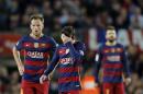 FC Barcelona's Lionel Messi, center, reacts after Valencia scored during a Spanish La Liga soccer match between Barcelona and Valencia, at the Camp Nou stadium in Barcelona, Spain, Sunday, April 17, 2016. (AP Photo/Manu Fernandez)