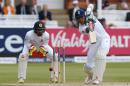 England's Alex Hales (R) plays a shot watched by Sri Lanka's wicketkeeper Dinesh Chandimal during play on the fourth day of the third test cricket match between England and Sri Lanka at Lord's cricket ground in London, on June 12, 2016