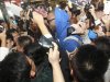 Fans take photos of former NBA player McGrady as he arrives at Qingdao airport