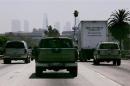 Cars and trucks travel on freeway in Los Angeles