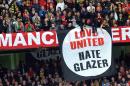Manchester United supporters hold anti-Glazer family banners during their English Premier League football match against Liverpool at Old Trafford in Manchester, north-west England, on March 21, 2010