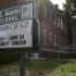 This Thursday, July 5, 2012 photo shows the exterior of the 88 year-old Charles E. Gorton High School in Yonkers, N.Y.  The Yonkers school district is looking for investors to pay for a $1.7 billion overhaul of dozens of schools, including Gorton, built in 1924 and 43% over-enrolled, according to school district officials.  To replace the building would cost $128 million and to overhaul it with repairs would cost $428 million, according to John Carr, who heads up the Yonkers Public Schools Facilities division. Across the country, innovative deals are now being discussed that would put essential pieces of public infrastructure in the hands of global investment firms, the latest effort to cope with a lingering fiscal crisis that has left some communities unable to pay for their needs. (AP Photo/Kathy Willens)