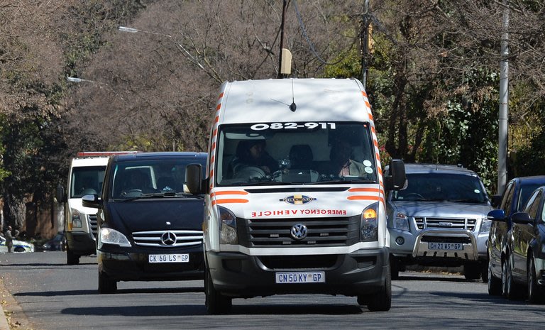 An ambulance carrying former South African president Nelson Mandela arrives at his home, September 1, 2013, Johannesburg