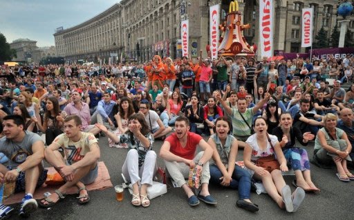 Fans in Kiev watch on a giant screen the Euro 2012 championships Group B match the Netherlands vs Denmark