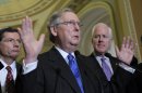 Senate Minority Leader Mitch McConnell of Ky., center, flanked by Sen. John Barrasso, R-Wyo., left, and Senate Minority Whip John Cornyn of Texas, gestures during a news conference on Capitol Hill in Washington, Tuesday, March 12, 2013. (AP Photo/Susan Walsh)