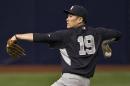 New York Yankees pitcher Masahiro Tanaka loosens up before throwing in the bullpen before a baseball game between the Yankees and the Tampa Bay Rays Saturday, Aug. 16, 2014, in St. Petersburg, Fla. (AP Photo/Steve Nesius)