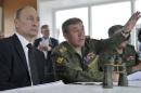 Russian President Putin and Chief of Staff Gerasimov watch military exercises in Russia's Zabaykalsky region