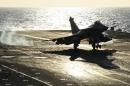 A French Rafale fighter lands aboard the Charles de Gaulle aircraft carrier on November 23, 2015, part of the operation in Syria and Iraq against the Islamic State group