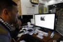An Iraqi man looks at the official website of the country's prime minister in Baghdad on February 2, 2013