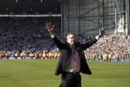 Manchester United's Scottish manager Alex Ferguson acknowledges fans at The Hawthorns in West Bromwich, on May 19, 2013