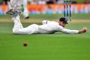 New Zealand's Martin Guptill misses a catch from Australia's Adam Voges during day three of the second cricket Test match at the Hagley Park in Christchurch on February 22, 2016