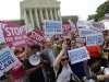 Supporters of President Barack Obama's health care law celebrate outside the Supreme Court in Washington, Thursday, June 28, 2012, after the court's ruling. AP Photo/David Goldman)