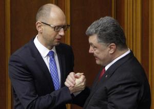 Ukraine&#39;s President Poroshenko clasps hands with &hellip;