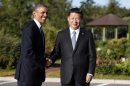 U.S. President Barack Obama shakes hands as he meets with China's President Xi Jinping at the G20 Summit in St. Petersburg