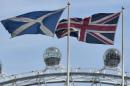 The Scottish saltire flag and Union flag fly outside the Scottish Office in central London