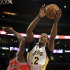 Los Angeles Lakers center Dwight Howard (12) shoots as Chicago Bulls center Nazr Mohammed (48) defends in the first half of an NBA basketball game in Los Angeles Sunday March 10, 2013. (AP Photo/Reed Saxon)