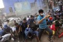 People run after they heard someone shouting that a building next to Rana Plaza is collapsing during a rescue operation in Savar