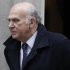 Britain's Business Secretary Vince Cable walks out of 10 Downing Street in central London