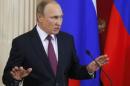 Russian President Putin speaks during a news conference in Moscow