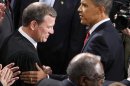 FILE - In this Jan. 27, 2010 file photo, President Barack Obama greets Chief Justice John Roberts before he delivered his State of the Union Address on Capitol Hill in Washington. Breaking with the court's other conservative justices, Roberts announced the judgment that allows the law to go forward with its aim of covering more than 30 million uninsured Americans. Roberts explained at length the court's view of the mandate as a valid exercise of Congress' authority to "lay and collect taxes." The administration estimates that roughly 4 million people will pay the penalty rather than buy insurance. (AP Photo/Charles Dharapak, File)