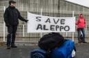 Participants of the solidarity march to Aleppo hold a banner reading "Save Aleppo" in Berlin, Germany, on December 26, 2016