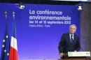 France's Prime Minister Ayrault delivers a speech at the end of a two-day environmental conference in Paris