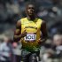 Jamaica's Usain Bolt finishes first in his men's 100m round 1 heats at the London 2012 Olympic Games at the Olympic Stadium