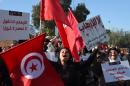 Tunisian women shout slogans during a demonstration outside parliament against allowing Tunisians who joined the ranks of jihadist groups to return to the country, in the capital Tunis on December 24, 2016